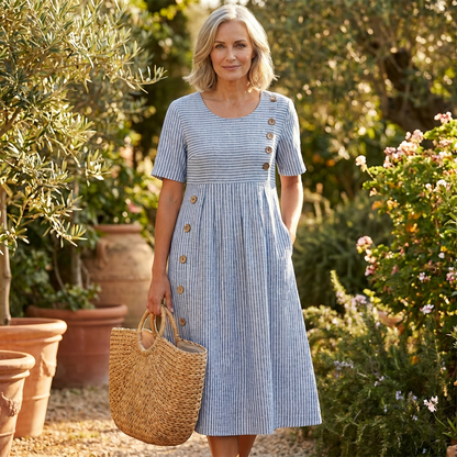 Woman wearing the blue striped midi dress outdoors